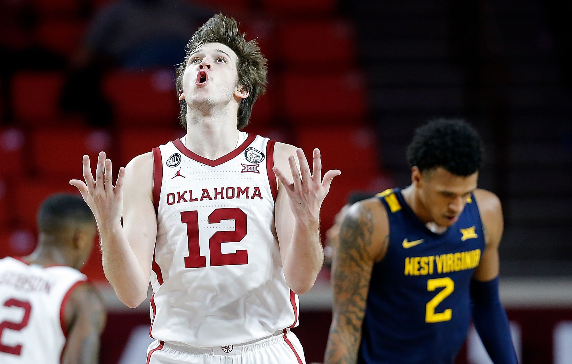 Oklahoma holds off No. 9 West Virginia in second half for a 75-71 victory